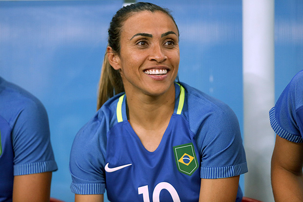 Brazil's Marta smiles sitting on the bench during a group E match of the women's Olympic football tournament between South Africa and Brazil at the Arena Amazonia stadium in Manaus, Brazil, Tuesday, Aug. 9, 2016. (AP Photo/Michael Dantas) ORG XMIT: XMC123