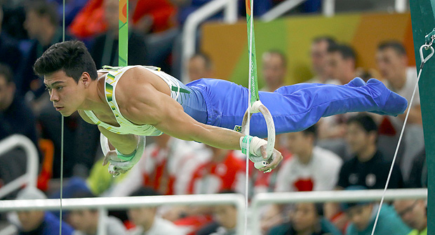 2016 Rio Olympics - Artistic Gymnastics - Final - Men's Individual All-Around Final - Rio Olympic Arena - Rio de Janeiro, Brazil - 10/08/2016. Sergio Sasaki (BRA) of Brazil competes on the rings, REUTERS/Mike Blake FOR EDITORIAL USE ONLY. NOT FOR SALE FOR MARKETING OR ADVERTISING CAMPAIGNS. ORG XMIT: OLYGK139
