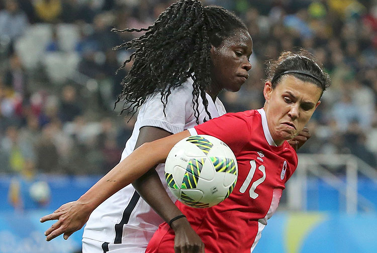 2016 Rio Olympics - Soccer - Quarterfinal - Women's Football Tournament Quarterfinal - Corinthians Arena - Sao Paulo, Brazil - 12/08/2016. Griedge Mbock Bathy (FRA) of France battles Christine Sinclair (CAN) of Canada. REUTERS/Paulo Whitaker FOR EDITORIAL USE ONLY. NOT FOR SALE FOR MARKETING OR ADVERTISING CAMPAIGNS. ORG XMIT: MIA286