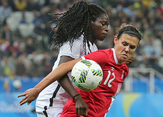 2016 Rio Olympics - Soccer - Quarterfinal - Women's Football Tournament Quarterfinal - Corinthians Arena - Sao Paulo, Brazil - 12/08/2016. Griedge Mbock Bathy (FRA) of France battles Christine Sinclair (CAN) of Canada. REUTERS/Paulo Whitaker FOR EDITORIAL USE ONLY. NOT FOR SALE FOR MARKETING OR ADVERTISING CAMPAIGNS. ORG XMIT: MIA286