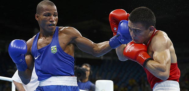2016 Rio Olympics - Boxing - Quarterfinal - Men's Light (60kg) Quarterfinals Bout 136 - Riocentro - Pavilion 6 - Rio de Janeiro, Brazil - 12/08/2016. Hurshid Tojibaev (UZB) of Uzbekistan and Robson Conceicao (BRA) of Brazil compete. REUTERS/Peter Cziborra FOR EDITORIAL USE ONLY. NOT FOR SALE FOR MARKETING OR ADVERTISING CAMPAIGNS. ORG XMIT: OLYDH167