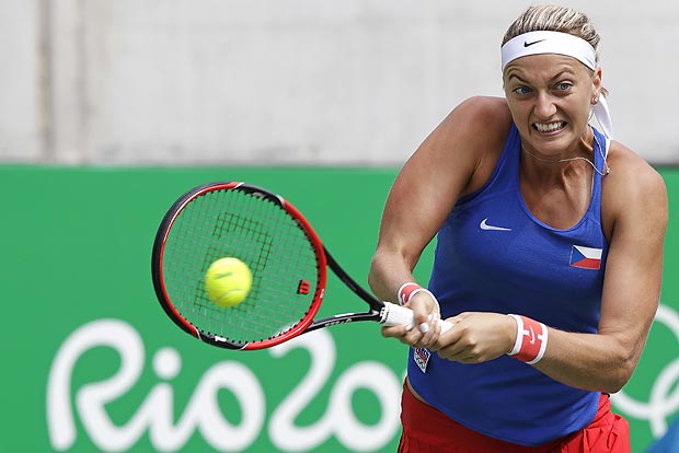 Petra Kvitova, of the Czech Republic, returns to Monica Puig, of Puerto Rico, during their semi-final round match at the 2016 Summer Olympics in Rio de Janeiro, Brazil, Friday, Aug. 12, 2016. (AP Photo/Charles Krupa) ORG XMIT: OKRU101
