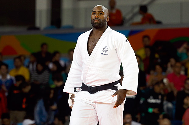 France's Teddy Riner arrives to competes against Algeria's Mohammed Amine Tayeb during the men's over 100-kg judo competition at the 2016 Summer Olympics in Rio de Janeiro, Brazil, Friday, Aug. 12, 2016. (AP Photo/Markus Schreiber) ORG XMIT: OJUD129