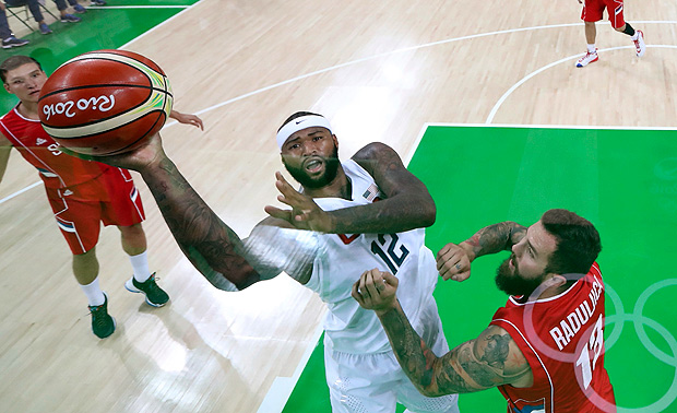 2016 Rio Olympics - Basketball - Preliminary - Men's Preliminary Round Group A USA v Serbia - Carioca Arena 1 - Rio de Janeiro, Brazil - 12/08/2016. Demarcus Cousins (USA) of the USA shoots over Miroslav Raduljica (SRB) of Serbia. REUTERS/Tom Pennington/Pool FOR EDITORIAL USE ONLY. NOT FOR SALE FOR MARKETING OR ADVERTISING CAMPAIGNS. ORG XMIT: MJB50