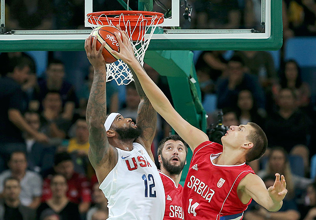 2016 Rio Olympics - Basketball - Preliminary - Men's Preliminary Round Group A USA v Serbia - Carioca Arena 1 - Rio de Janeiro, Brazil - 12/08/2016. Demarcus Cousins (USA) of the USA is blocked by Nikola Jokic (SRB) of Serbia as Stefan Markovic (SRB) of Serbia reacts. REUTERS/Jim Young FOR EDITORIAL USE ONLY. NOT FOR SALE FOR MARKETING OR ADVERTISING CAMPAIGNS. ORG XMIT: MJB38