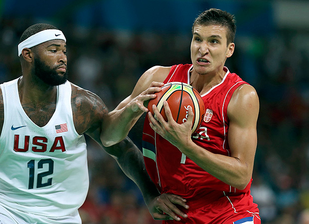 2016 Rio Olympics - Basketball - Preliminary - Men's Preliminary Round Group A USA v Serbia - Carioca Arena 1 - Rio de Janeiro, Brazil - 12/08/2016. Bogdan Bogdanovic (SRB) of Serbia and Demarcus Cousins (USA) of the USA in action. REUTERS/Damir Sagolj FOR EDITORIAL USE ONLY. NOT FOR SALE FOR MARKETING OR ADVERTISING CAMPAIGNS. ORG XMIT: MJB81