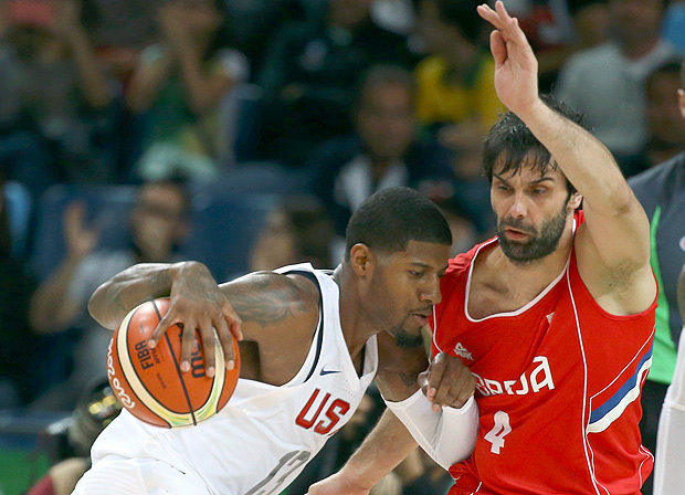 2016 Rio Olympics - Basketball - Preliminary - Men's Preliminary Round Group A USA v Serbia - Carioca Arena 1 - Rio de Janeiro, Brazil - 12/08/2016. Paul George (USA) of the USA and Milos Teodosic (SRB) of Serbia compete. REUTERS/Damir Sagolj FOR EDITORIAL USE ONLY. NOT FOR SALE FOR MARKETING OR ADVERTISING CAMPAIGNS. ORG XMIT: MJB77