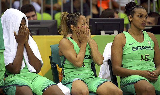 2016 Rio Olympics - Basketball - Preliminary - Women's Preliminary Round Group A Turkey v Brazil - Youth Arena - Rio de Janeiro, Brazil - 13/08/2016. Isabela Macedo (BRA) of Brazil, Adriana Moises (BRA) of Brazil and Kelly Santos (BRA) of Brazil look on from the bench. REUTERS/Shannon Stapleton FOR EDITORIAL USE ONLY. NOT FOR SALE FOR MARKETING OR ADVERTISING CAMPAIGNS. ORG XMIT: CDC94