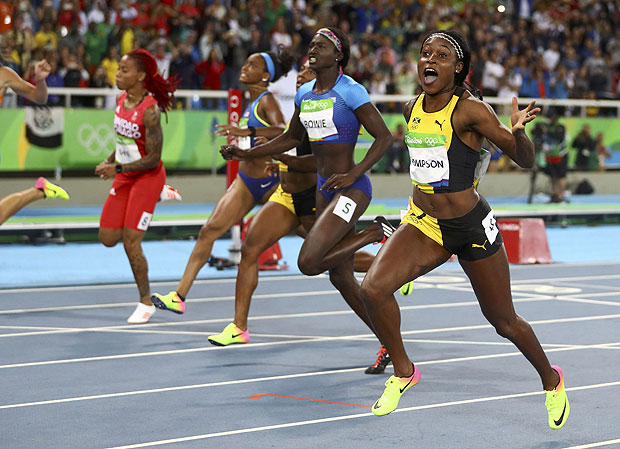 2016 Rio Olympics - Athletics - Final - Women's 100m Final - Olympic Stadium - Rio de Janeiro, Brazil - 13/08/2016. Elaine Thompson (JAM) of Jamaica celebrates winning the gold. REUTERS/Kai Pfaffenbach FOR EDITORIAL USE ONLY. NOT FOR SALE FOR MARKETING OR ADVERTISING CAMPAIGNS. ORG XMIT: OLYGK159