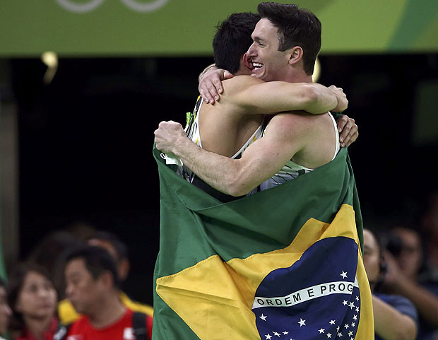 2016 Rio Olympics - Artistic Gymnastics - Final - Men's Floor Final - Rio Olympic Arena - Rio de Janeiro, Brazil - 14/08/2016. Arthur Mariano (BRA) of Brazil and Diego Hypolito (BRA) of Brazil celebrate after taking bronze and silver respectively. REUTERS/Marko Djurica TPX IMAGES OF THE DAY FOR EDITORIAL USE ONLY. NOT FOR SALE FOR MARKETING OR ADVERTISING CAMPAIGNS. ORG XMIT: OLYTS25