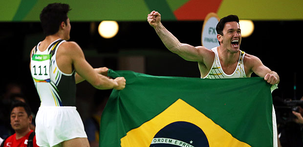 2016 Rio Olympics - Artistic Gymnastics - Final - Men's Floor Final - Rio Olympic Arena - Rio de Janeiro, Brazil - 14/08/2016. Arthur Mariano (BRA) of Brazil and Diego Hypolito (BRA) of Brazil celebrate after taking bronze and silver respectively. REUTERS/Marko Djurica FOR EDITORIAL USE ONLY. NOT FOR SALE FOR MARKETING OR ADVERTISING CAMPAIGNS. ORG XMIT: OLYTS26