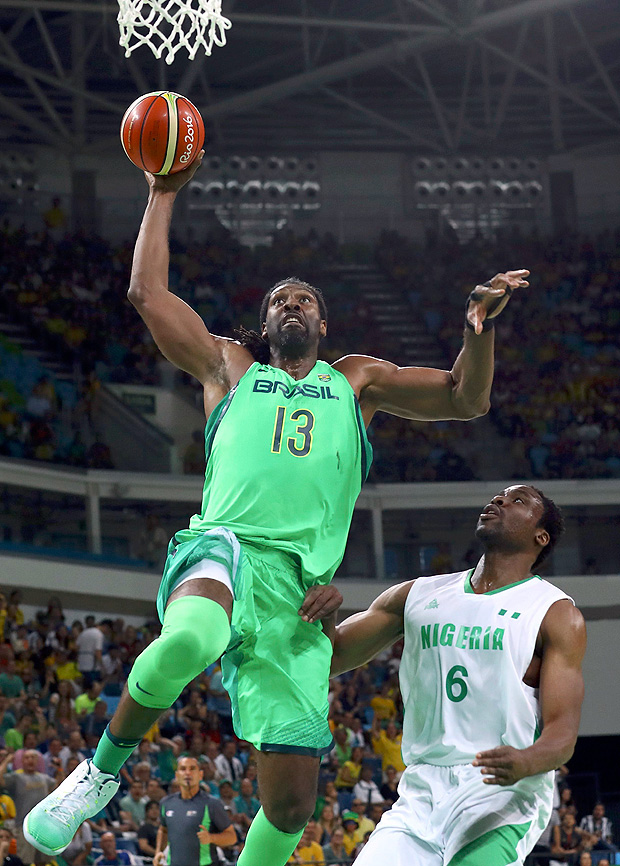 2016 Rio Olympics - Basketball - Preliminary - Men's Preliminary Round Group B Nigeria v Brazil - Carioca Arena 1 - Rio de Janeiro, Brazil - 15/08/2016. Nene Hilario (BRA) of Brazil shoots over Ike Diogu (NGR) of Nigeria. REUTERS/Jim Young FOR EDITORIAL USE ONLY. NOT FOR SALE FOR MARKETING OR ADVERTISING CAMPAIGNS. ORG XMIT: MJB04