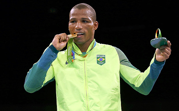 2016 Rio Olympics - Boxing - Victory Ceremony - Men's Light (60kg) Victory Ceremony - Riocentro - Pavilion 6 - Rio de Janeiro, Brazil - 16/08/2016. Gold medalist Robson Conceicao (BRA) of Brazil poses with his medal. REUTERS/Peter Cziborra FOR EDITORIAL USE ONLY. NOT FOR SALE FOR MARKETING OR ADVERTISING CAMPAIGNS. ORG XMIT: OLYDH288