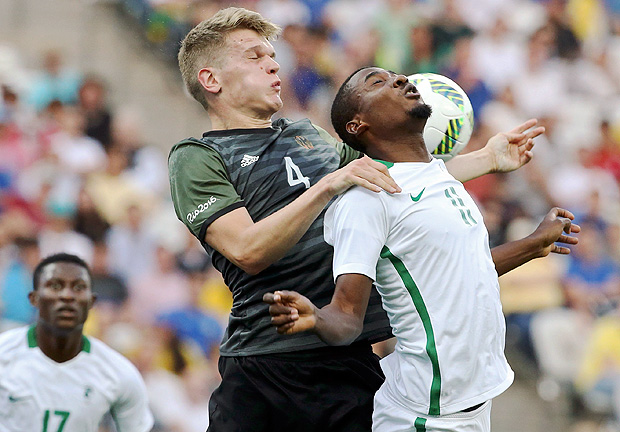 2016 Rio Olympics - Soccer - Semifinal - Men's Football Tournament Semifinal Nigeria v Germany - Corinthians Arena - Sao Paulo, Brazil - 17/08/2016. Matthias Ginter (GER) of Germany and Oluwafemi Ajayi (NGR) of Nigeria collide as they go for a head ball during the second half. REUTERS/Paulo Whitaker FOR EDITORIAL USE ONLY. NOT FOR SALE FOR MARKETING OR ADVERTISING CAMPAIGNS. ORG XMIT: STE1837