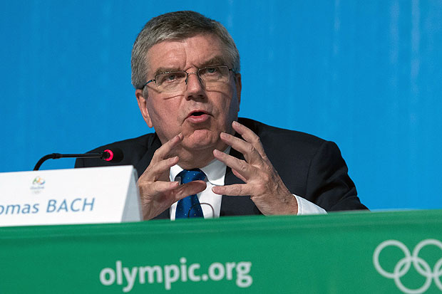 IOC President Thomas Bach speaks during the traditionnal end of the Games press conference on August 20, 2016 in Rio de Janeiro on the eve of the closing ceremony of the Rio 2016 Olympic games. IOC president Thomas Bach said Saturday that the troubled Rio Olympics, marked by financial crisis and empty stadiums, have been "iconic" and Brazil have been "great" hosts. / AFP PHOTO / Laurent KALFALA