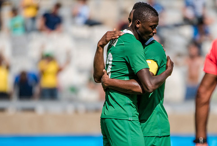 Nigeria's Sadiq Umar (L) celebrates with teammate John Obi Mikel after scoring against Honduras during the Rio 2016 Olympic Games men's bronze medal football match at the Mineirao stadium in Belo Horizonte, Brazil, on August 20, 2016. / AFP PHOTO / GUSTAVO ANDRADE