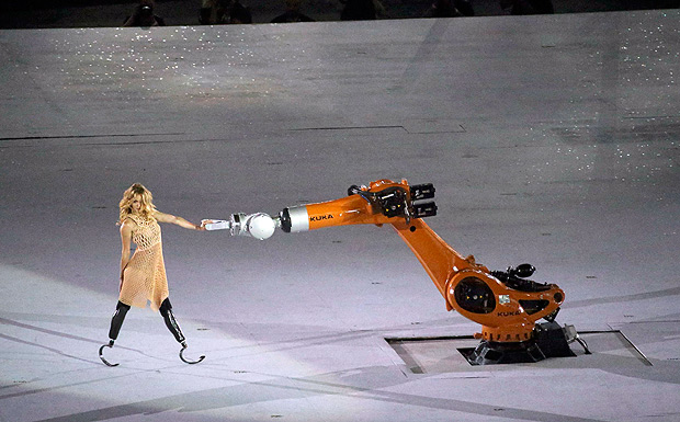 2016 Rio Paralympics - Opening ceremony - Maracana - Rio de Janeiro, Brazil - 07/09/2016. A performer interacts with a robotic arm during the opening ceremony. REUTERS/Sergio Moraes FOR EDITORIAL USE ONLY. NOT FOR SALE FOR MARKETING OR ADVERTISING CAMPAIGNS. ORG XMIT: OLYHB176