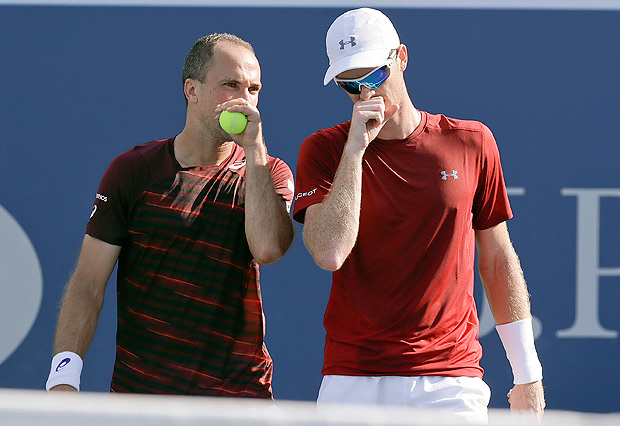 Bruno Soares, of Brazil, left, talks with doubles partner Jamie Murray, of the United Kingdom, during the men's doubles semifinals against Pierre-Hugues Herbert, of France, and Nicolas Mahut, of France, at the U.S. Open tennis tournament, Thursday, Sept. 8, 2016, in New York. (AP Photo/Charles Krupa) ORG XMIT: USO116