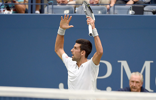 Novak Djokovic of Serbia reacts to a point against Gael Monfils of France during their 2016 US Open men's singles semifinals match at the USTA Billie Jean King National Tennis Center on September 9, 2016 in New York. / AFP PHOTO / Timothy A. CLARY