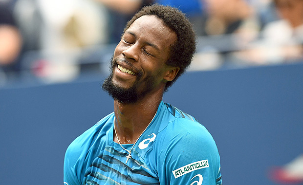 Gael Monfils of France reacts to a point against Novak Djokovic of Serbia during their 2016 US Open men's singles semifinals match at the USTA Billie Jean King National Tennis Center on September 9, 2016 in New York. / AFP PHOTO / Jewel SAMAD