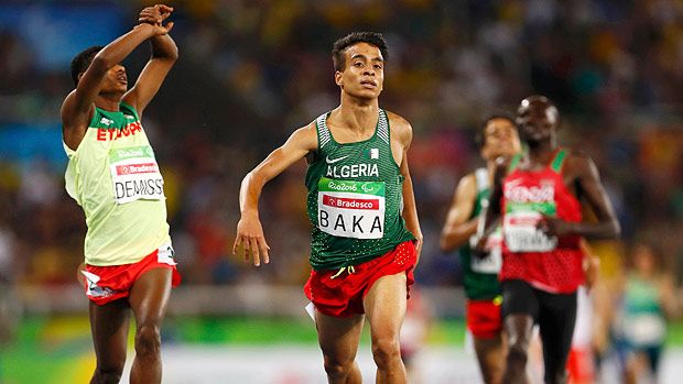 2016 Rio Paralympics - Athletics - Men's 1500m - T13 Final - Olympic Stadium - Rio de Janeiro, Brazil - 11/09/2016. Abdellatif Baka of Algeria (C) wins the gold medal in the event while Tamiru Demisse of Ethiopia (L) takes the silver. REUTERS/Jason Cairnduff FOR EDITORIAL USE ONLY. NOT FOR SALE FOR MARKETING OR ADVERTISING CAMPAIGNS. ORG XMIT: OLYHB33