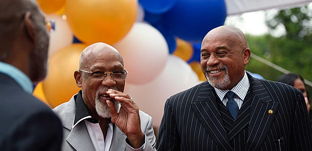 John Carlos, left, and Tommie Smith smile during an event in Washington on Wednesday, Sept. 28, 2016. Carlos and Smith voiced their support for Colin Kaepernick and other athletes staging national anthem protests, 48 years after they raised their gloved fists on the podium in a symbolic protest at the Olympics. (AP Photo/Sait Serkan Gurbuz) ORG XMIT: DCSG102