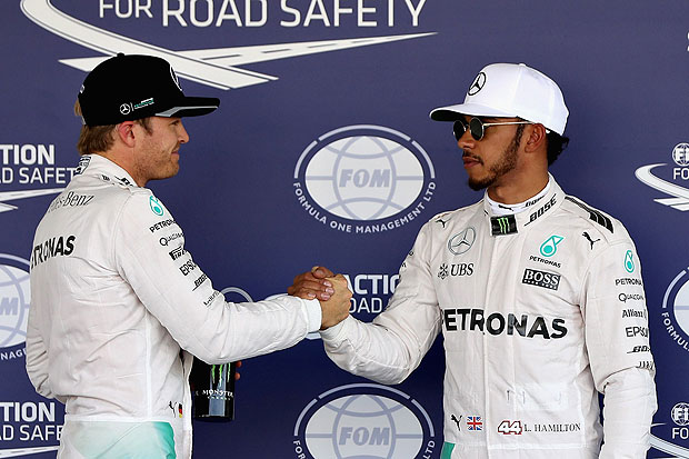 MEXICO CITY, MEXICO - OCTOBER 29: Nico Rosberg of Germany and Mercedes GP congratulates Lewis Hamilton of Great Britain and Mercedes GP after Lewis qualified on pole during qualifying for the Formula One Grand Prix of Mexico at Autodromo Hermanos Rodriguez on October 29, 2016 in Mexico City, Mexico. Mark Thompson/Getty Images/AFP == FOR NEWSPAPERS, INTERNET, TELCOS & TELEVISION USE ONLY ==
