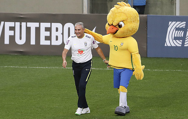 Brazil's coach Tite jokes with a mascot during a training session in Belo Horizonte, Brazil, Monday, Nov. 7, 2016. Brazil will face Argentina in a 2018 World Cup qualifying soccer match on Thursday. (AP Photo/Andre Penner) ORG XMIT: XAP118