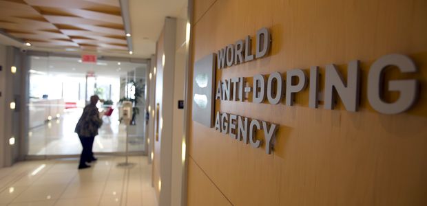 A woman walks into the head office for the World Anti-Doping Agency (WADA) in Montreal, November 9, 2015. An international anti-doping commission recommended on Monday that Russia's Athletics Federation be banned from international competition over widespread doping offences - a move that could see the powerhouse Russian team excluded from next year's Rio Olympics. Russian sports minister said there was no evidence for the accusations against the Federation. REUTERS/Christinne Muschi TPX IMAGES OF THE DAY ORG XMIT: CMU02
