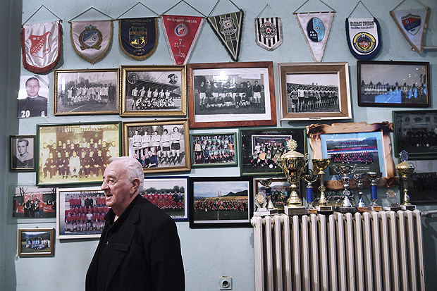  Petar Milosavljevic, the secretary of FK Trepca, with heirlooms of the soccer club’s storied past, in Mitrovica, Kosovo, Sept. 29, 2016. None of the trophies is from before 1991, when most of the Albanian players left to form their own team, KF Trepca; the two clubs carry on a bitter dispute over the past as both have faded away. (James Hill/The New York Times) — NO SALES — - XNYT54 
