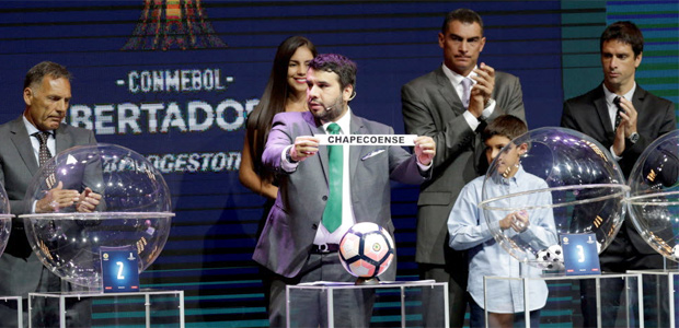 Football Soccer - 2017 Copa Libertadores draw - CONMEBOL headquarters, Luque, Paraguay - 21/12/2016 Paraguay's Hugo Figueredo (C) holds up a piece of paper showing Brazil's Chapecoense during the draw. REUTERS/Jorge Adorno ORG XMIT: ASU21