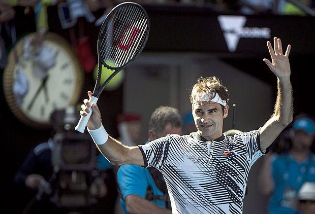 Federer comemora vitria sobre o americano Noah Rubin