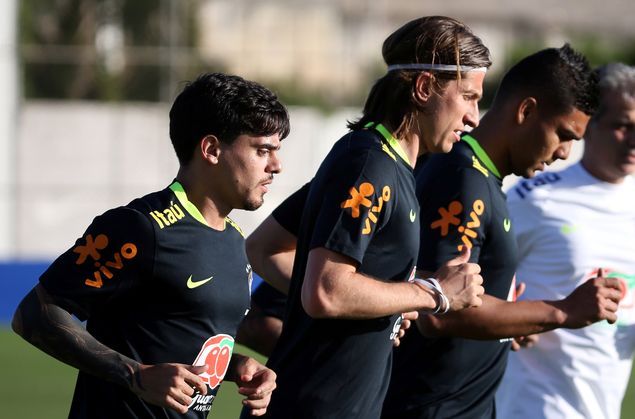 Football Soccer - Brazil's national soccer team training - World Cup 2018 Qualifiers - CT Corinthians, Sao Paulo, Brazil - 20/3/17. Casemiro (R), Filipe Luis and Fagner (L) attend a training session. REUTERS/Paulo Whitaker ORG XMIT: PW108
