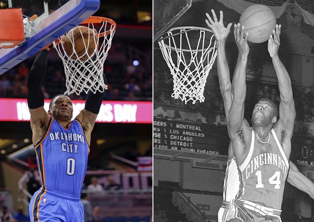 FILE - At left, in a March 29, 2017, file photo, Oklahoma City Thunder's Russell Westbrook makes an uncontested dunk against the Orlando Magic during the first half of an NBA basketball game, in Orlando, Fla. At right, in a Feb. 3, 1962, file photo, Cincinnati guard Oscar Robertson goes to the basket against the New York Knicks, in New York. Oklahoma City Thunder guard Russell Westbrook is one triple-double away from matching Oscar Robertson's single-season record. (AP Photo/File) ORG XMIT: NY152