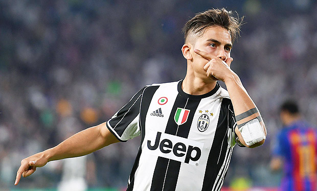 Juventus' Paulo Dybala celebrates after scoring during a Champions League, quarterfinal, first-leg soccer match between Juventus and Barcelona, at the Juventus Stdium in Turin, Italy, Tuesday, April 11, 2017. (Alessandro Di Marco/ANSA via AP) ORG XMIT: TUR101