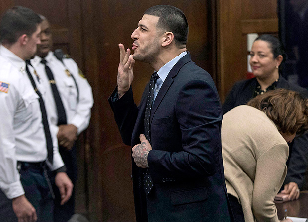 FILE - In this Wednesday, April 12, 2017, file photo, former New England Patriots tight end Aaron Hernandez blows a kiss to his daughter, who sat with her mother, Shayanna Jenkins Hernandez, Hernandez's longtime fiancee, during jury deliberations in his double-murder trial at Suffolk Superior Court in Boston. Hernandez was acquitted of those crimes on Friday, but hanged himself in his prison early Wednesday, April 19, 2017, where he was serving a life sentence in the 2013 killing of semi-professional football player Odin Lloyd. (Keith Bedford /The Boston Globe via AP, Pool, File) ORG XMIT: MABOD501