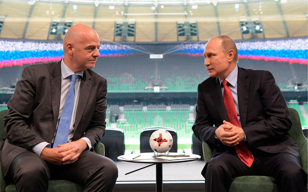 FILE - In this Tuesday, May 23, 2017 file photo, Russian President Vladimir Putin, right, meets with FIFA President Gianni Infantino at the FC Krasnodar Stadium in the southern city of Krasnodar, Russia. The Confederations Cup soccer tournament might have some fans around the world. If so, they should enjoy this one in Russia while they can. FIFA's eight-nation World Cup rehearsal for the host country, six continental champions and World Cup title-holder is no sure thing to survive for another edition. "If there was no Confed Cup in 2021, I wouldn't be unhappy," Germany coach Joachim Loew said last month, naming a squad for Russia with only three of his 2014 World Cup players. "I don't think those involved would be unhappy either."(Alexei Druzhinin/Pool Photo via AP, file) ORG XMIT: LON127