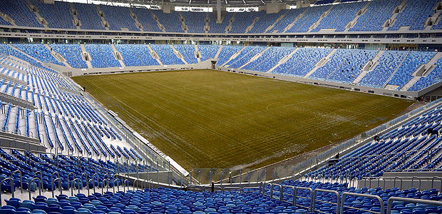 (FILES) This file photo taken on February 27, 2017 shows a general view of the pitch at the new football stadium at Krestovsky island, also known as the Zenit Arena, in Saint Petersburg. Less than a month before it was due to host the opening match of the Confederations Cup on June 17, 2017, officials were forced to lay a new pitch after the old one broke up during trial games. / AFP PHOTO / Olga MALTSEVA