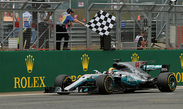 F1 - Formula One - British Grand Prix 2017 - Silverstone, Britain - July 16, 2017 Mercedes' Lewis Hamilton crosses the line to win the race REUTERS/Andrew Boyers ORG XMIT: AI