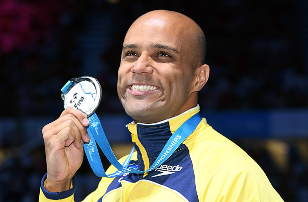 Brazil's Joao Gomes Junior poses with his silver medal during the podium ceremony for the men's 50m breaststroke final during the swimming competition at the 2017 FINA World Championships in Budapest, on July 26, 2017. / AFP PHOTO / Franois-Xavier MARIT