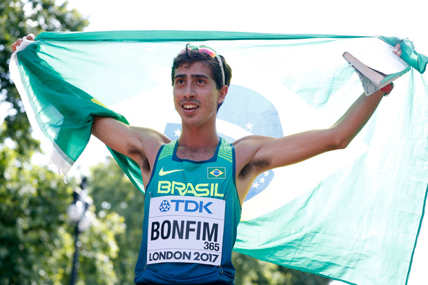Bronze medal winner Brazil's Caio Bonfim celebrates after the men's 20-kilometer race walk at the World Athletics Championships in London Sunday, Aug. 13, 2017. (AP Photo/Kirsty Wigglesworth) ORG XMIT: MAS113
