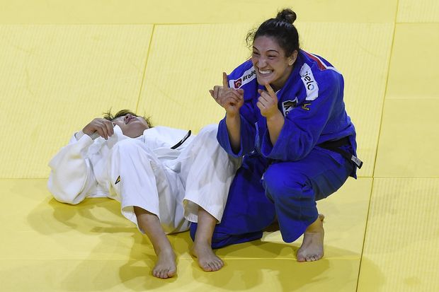 Mayra Aguiar, in blue, of Brazil wins against Mami Umeki of Japan in the women's 78kg category final match during the World Judo Championships in Papp Laszlo Budapest Sports Arena in Budapest, Hungary, Friday, Sept. 1, 2017. (Tamas Kovacs/MTI via AP)