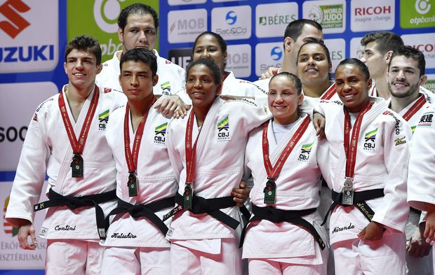 Second placed Team Brazil pose for photographs during the medal ceremony for the team competition at the World Judo Championships in Papp Laszlo Budapest Sports Arena in Budapest, Hungary, Sunday, Sept. 3, 2017. (Tibor Illyes/MTI via AP)