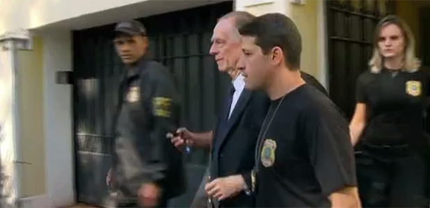 Carlos Nuzman, President of the Brazilian Olympic Committee, is escorted by federal police officers after being taken into custody at his home, in Rio de Janeiro
