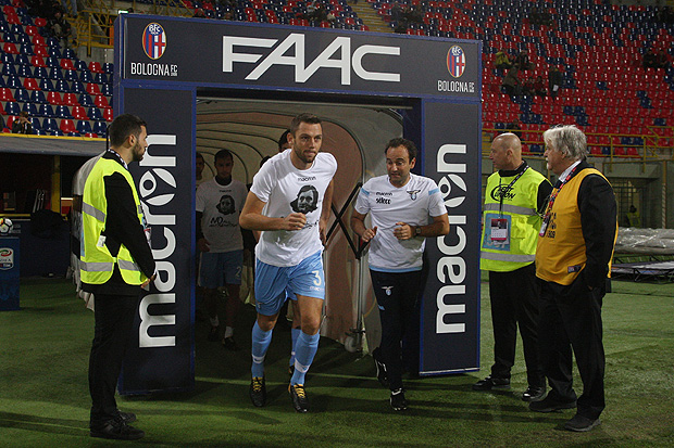 Lazio's defender from Netherlands Stefan de Vrij wears a t-shirt showing an image of holocaust victim Anne Frank, during the warm up prior the Italian Serie A football match Bologna vs Lazio on October 25, 2017 at the Renato-Dall'Ara stadium in Bologna. Emotions were still running high in Italy, days after Lazio fans posted anti-semitic photos of Anne Frank in a Roma jersey in the stands of the Stadio Olimpico. The Italian football federation announced that there will be a minute's reflection on the Holocaust before every match and a passage read from 