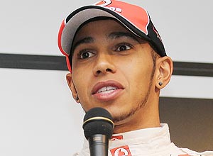 ORG XMIT: NL035 WATKINS GLEN, NY - JUNE 14: Lewis Hamilton of England, driver of the Vodafone McLaren Mercedes MP4-23, talks with the media during the Mobil 1 Car Swap at Watkins Glen International on June 14, 2011 in Watkins Glen, New York. Nick Laham/Getty Images for Mobil 1/AFP == FOR NEWSPAPERS, INTERNET, TELCOS & TELEVISION USE ONLY ==