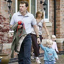 Kate and Gerry McCann, the parents of missing British girl Madeleine McCann, leave home twins with Sean (2nd R) and Amelie (R), in Rothley, central England September 12, 2007. Portugal's public prosecutor on Tuesday passed the case against the parents of missing 4-year-old Madeleine McCann to a criminal judge who will decide whether there are grounds for a trial. REUTERS/Andrew Stenning/Pool (BRITAIN)