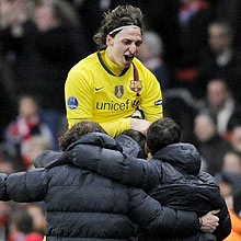 Barcelona's Zlatan Ibrahimovic, top, celebrates his goal with teammates during the Champions League quarterfinal first leg soccer match between Arsenal and Barcelona at the Emirates Stadium in London, Wednesday, March 31, 2010. (AP Photo/Tom Hevezi)