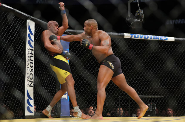 LAS VEGAS, NV - JULY 9: Daniel Cornier punches Anderson Silva during the UFC 200 event at T-Mobile Arena on July 9, 2016 in Las Vegas, Nevada. Rey Del Rio/Getty Images/AFP == FOR NEWSPAPERS, INTERNET, TELCOS & TELEVISION USE ONLY ==