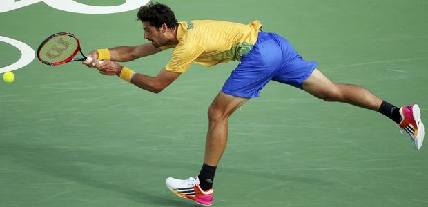 2016 Rio Olympics - Tennis - Quarterfinal - Men's Singles Quarterfinals - Olympic Tennis Centre - Rio de Janeiro, Brazil - 12/08/2016. Thomaz Bellucci (BRA) of Brazil in action against Rafael Nadal (ESP) of Spain. REUTERS/Kevin Lamarque FOR EDITORIAL USE ONLY. NOT FOR SALE FOR MARKETING OR ADVERTISING CAMPAIGNS. ORG XMIT: OLYN1834